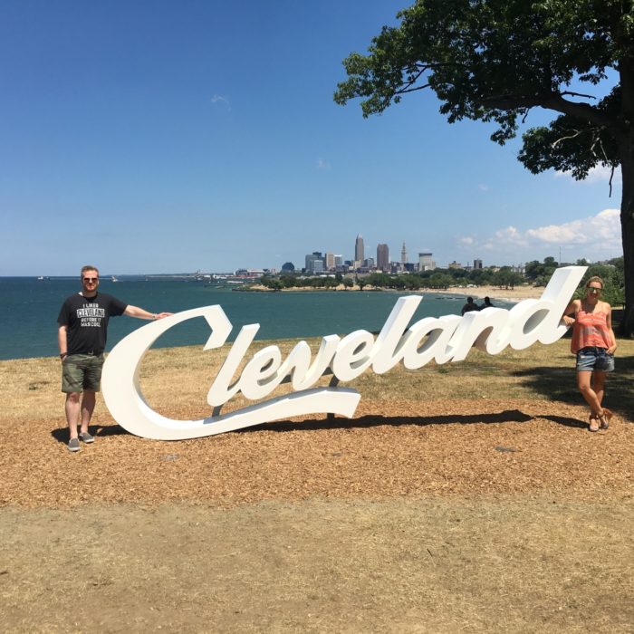 Christine Cameron of My Style Pill in front of the scripts Cleveland sign